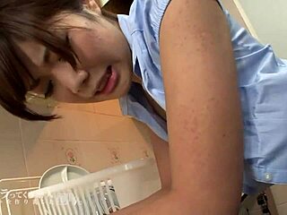 Asian housekeeper Reina Kawahara gives me a taste of her stick-style rotor after washing and cleaning
