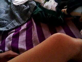 a lesbian amateur watches porn and starts masturbating passionately