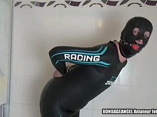 why's neoprene slave milf angela handcuffed in the shower catsuit bondage session?