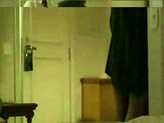 Stranger flashing in hotel room hidden from view