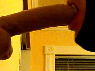 Gay guy in hood deepthroats dildo casually