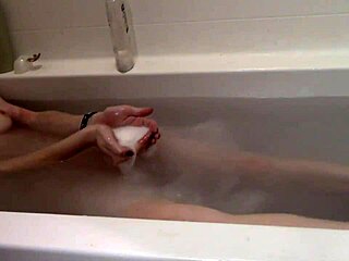 cute skinny blonde strips naked for a steamy bath session.