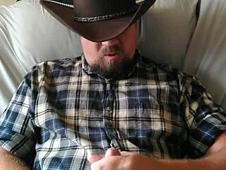 Cowboy strokes his cock to orgasm, building up a massive load