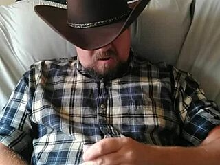 Gay amateur cowboy strokes his cock to climax