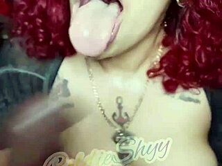 Redhead sucks big black dildo in Florida