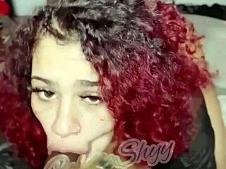 Redhead sucks big black dildo in Florida