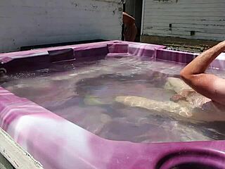 dayanara relaxing in the hot tub with a shaved look