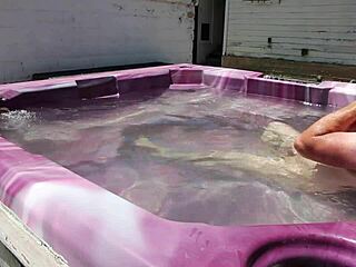 dayanara relaxing in the hot tub with a shaved look