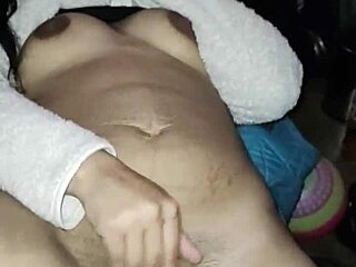 She masturbates intensely for her boyfriend, her body arching in pleasure as she reaches climax.