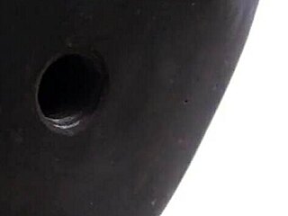 Taming a leather pet in bondage