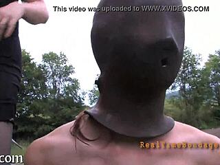 Taming a leather pet in bondage