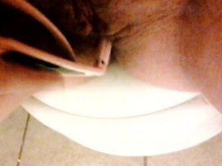 A girl in a home video enjoys some private relaxation.