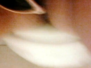 A girl in a home video enjoys some private relaxation.