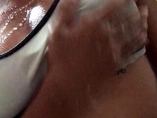 Amateur girl with natural tits showers and masturbates