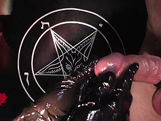 Latex-clad hands deliver a sensual handjob in tribute to Baphomet