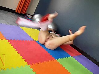 Regina Noir Practices Yoga In Transparent Red Leotard