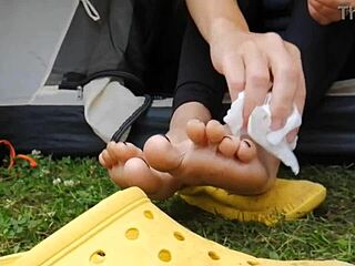 milf wipes dirty feet in leggings during camping trip