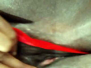 ebony milf masturbating with dildo in lingerie.