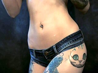 Teen in cosplay gets oiled and wet with cream.