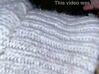 Mature blonde Cracky interacts with TV in reality show.