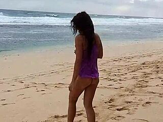 pink butt plug during beach yoga without panties on wild shore