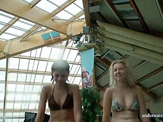 Marusia and Melisa Darkova strip and tease as underwater lesbian babes by the pool.