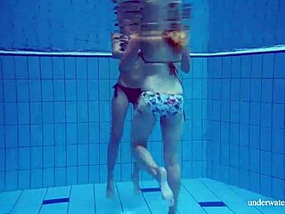 Brunette and blonde lesbians in pool shower