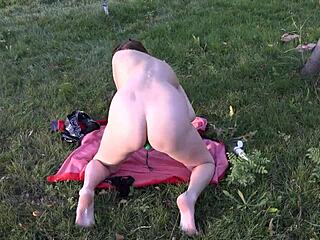 A hot MILF enjoys anal toys and masturbates outdoors in public
