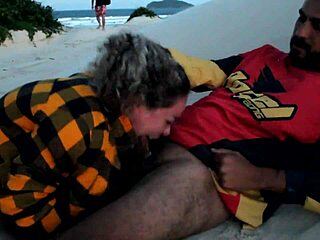 African beauty gives oral pleasure under the stars on the beach