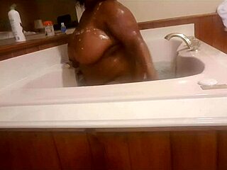 Marliese Morgan, the stunning ebony BBW, indulges in a sensual soap session.