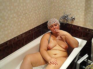 fat milf smokes cigarette in bath, hairy and plump with big ass and belly fetish