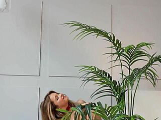 Blonde woman posing seductively in red heels