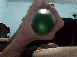 Gay man pleasures himself by fucking his ass with a cucumber