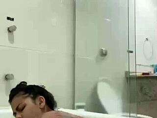 i'm bia hot brunette relaxing with the shower jet in the bath