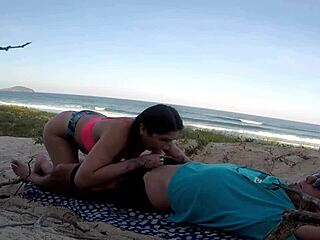 african woman seeks help on the beach