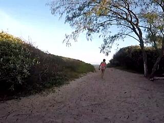 african woman seeks help on the beach