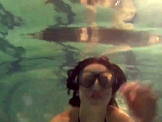 Kristina Andreeva is a brunette teen who swims naked in the pool.