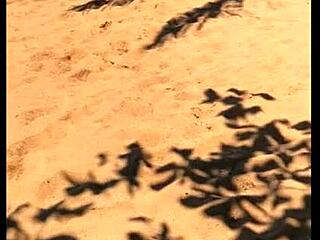 My wife peeing long on the beach in wild display