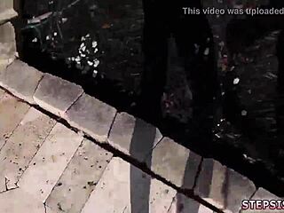 Three people having sex on a bed in a rather kinky scene.