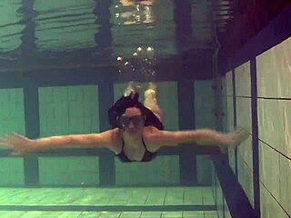 Kristina Andreeva is a brunette teen who swims naked in the pool.