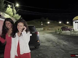 Curly brunette girlfriends share intriguing public pee near car in outdoor parking lot