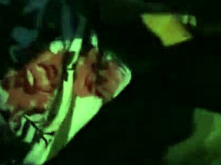 A real hooker performs a blowjob in a car outdoors.