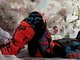 Gay biker treads boots in motocross costume?