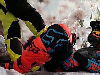 Gay biker treads boots in motocross costume?