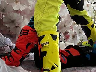 Gay biker treads boots in motocross costume?