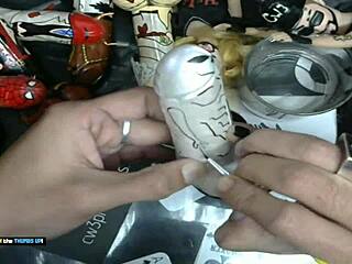 Finish painting the little grey alien - dildo art business
