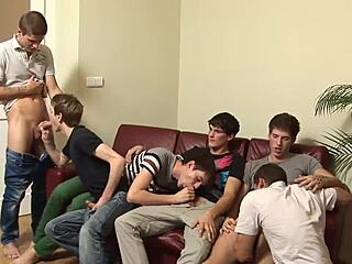 twink gets bareback fucked in gay group sex orgy.