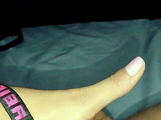 Asian milf masturbates while watching a movie