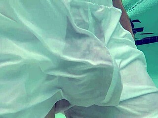 Hey, check out this pool boy with see-through underwater crossdressing fun