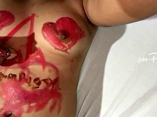 Close up of an amateur girl’s shaved and hairless Asian body with lipstick artworks